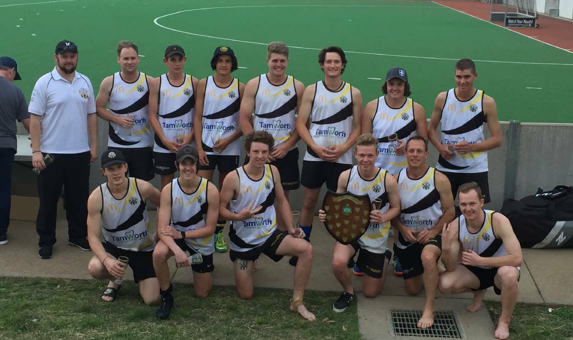 Dynasty: Farmilo (front second from right) celebrates Workies' grand final triumph last season. It was their 10th in 11 years. He's flanked by sons Calvin (left) and Isaac (right). 