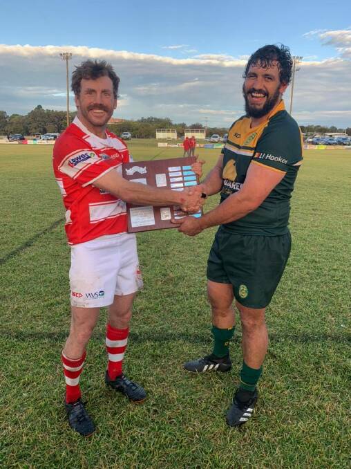 Memorable win: Inverell captain Luther Robinson (right) accepts the Neil Porter Shield from Walcha skipper Ed Churchill. Photo: Inverell Rugby Club Facebook