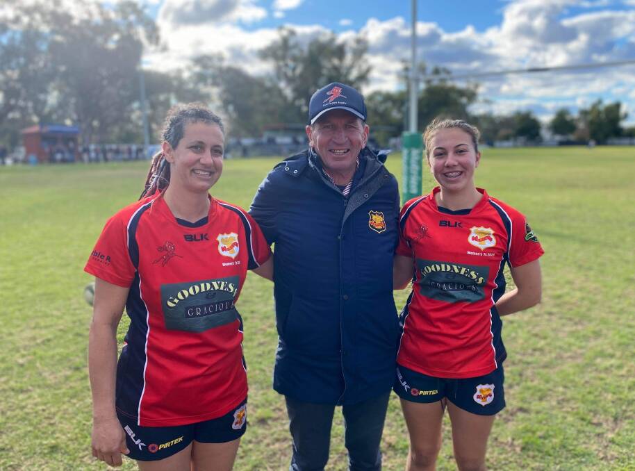 Special moment: Simone Lickorish (left) and daughter Emmy Barr (right) with Gunnedah coach John Hickey, after they became the first mother and daughter to play for the club on Saturday. Photo: Breanna Jones