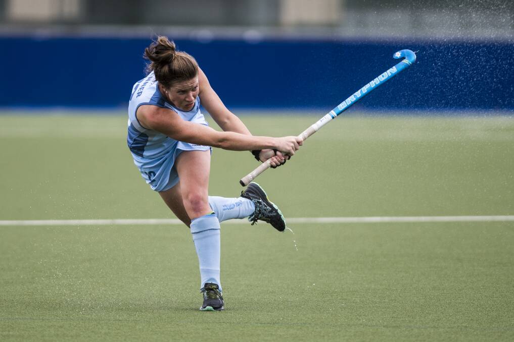 Whack: Tamworth's Kate Jenner in action for the NSW Arrows during their loss to the Canberra Strikers on Saturday. They are now preparing for the finals series, which hits-off on Thursday. Photo: Dion Georgopoulo  