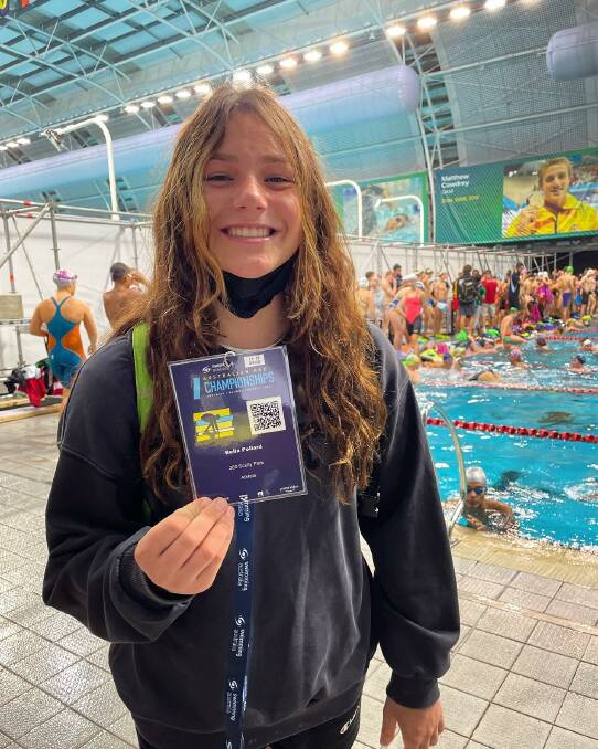 360 Scully Park's Bella Pollard receives her accreditation ahead of her 200m butterfly on Thursday. Photo: 360 Scully Park Facebook. 