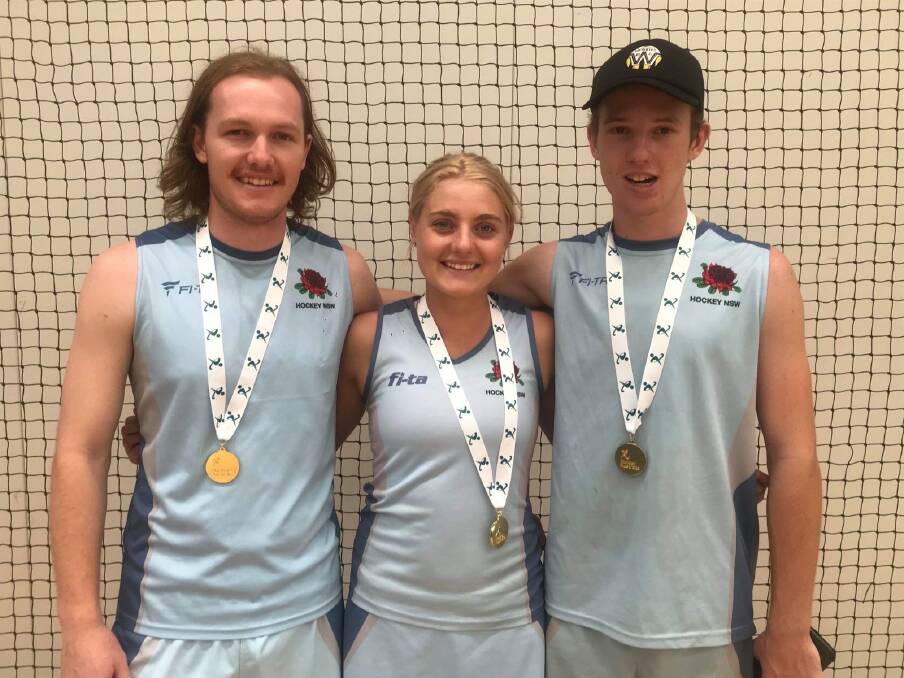 Golden touch: Tamworth's Isaac Farmilo, Abigail Doolan and Ehren Hazell helped their respective NSW under-21s sides be crowned champions at the Australian Indoor Hockey Festival.