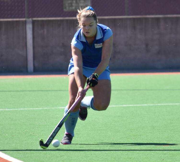 Stepping up: After four days of tough hockey at the women's indoor opens nationals, Emily Chaffey is backing up in the under-21s championships, where she is suiting up for the NSW Blues. Photo: Ben Jaffrey