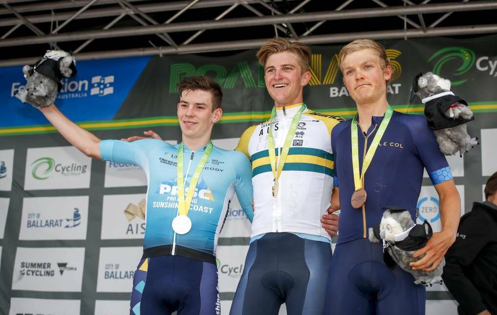 Sam Jenner (right) poses on the podium with winner Nicholas White (centre) and Michael Potter (left) following the U23 Men's Road Race at the 2019 Federation University Cycling Australia Road Nationals in Buninyong. Picture: Dylan Burns