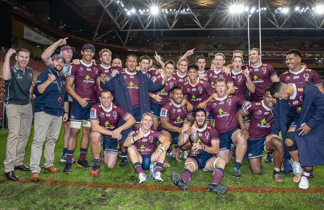 Sweet victory:The Queensland Reds celebrate winning back the Bob Templeton Cup.