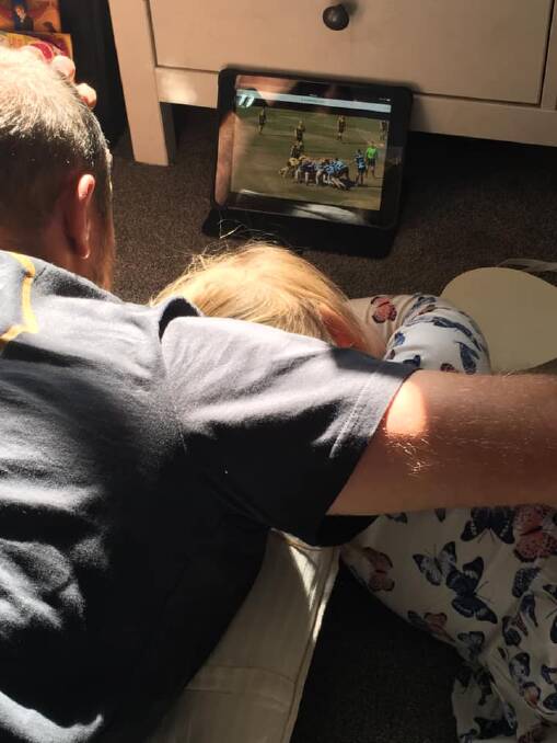 Daddy's little girl: Kelly and his 'apprentice' - daughter Piper, review a game. 