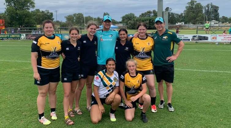 Brush with the best: Some of the Pirates 16s girls with Aussie men's 7s coaches Nathan Grey and Tim Walsh.