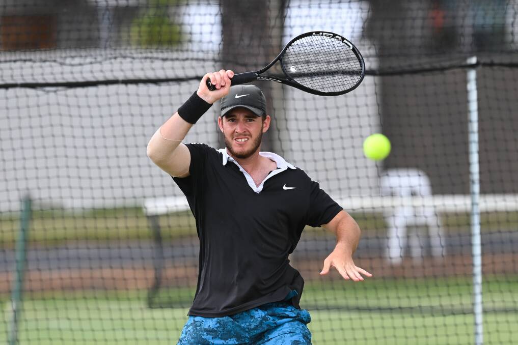 DETERMINED: Aaron Osmond played some great tennis to reach the final and pushed champion Brendon Moore all the way at the Victorian Grasscourt Championships. Photo: The Border Mail