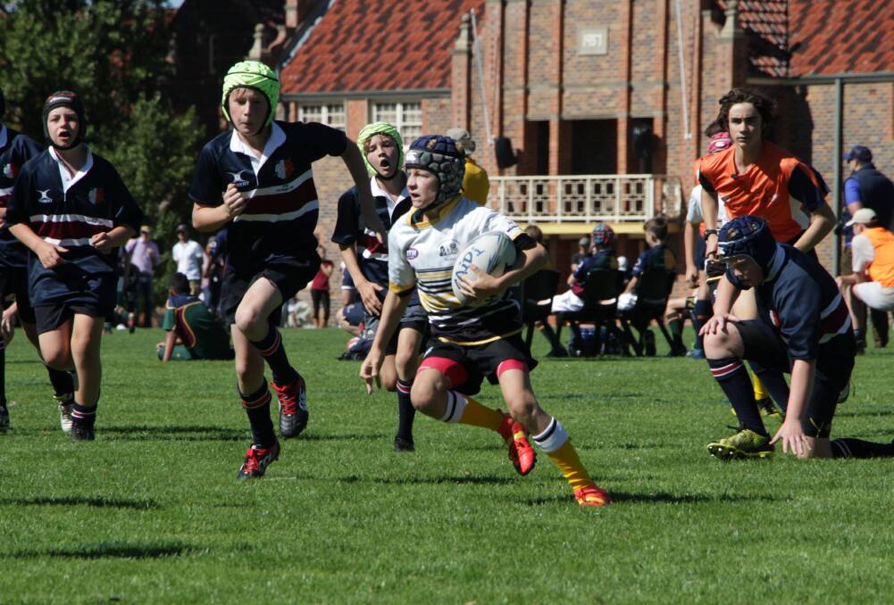 Learning experience: Oscar Turner enroute to the tryline for the Tamworth District Junior Rugby Union Club under-12s.

