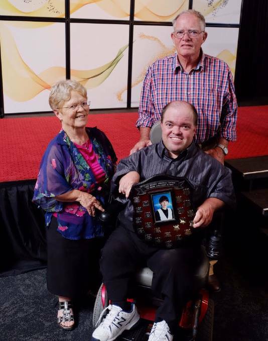 Simon Hood with parents Lesley and Phil after receiving the Cara Hickson Memorial Award in 2016.