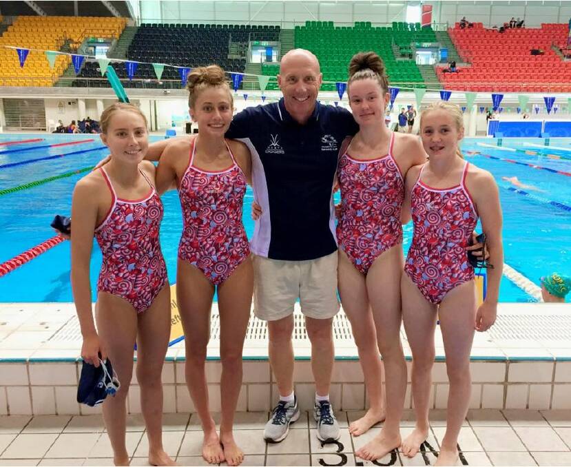Team effort: Tamworth City coach Nicholas Monet (centre) was delighted with the performance of the girls relay teams at the state age championships.