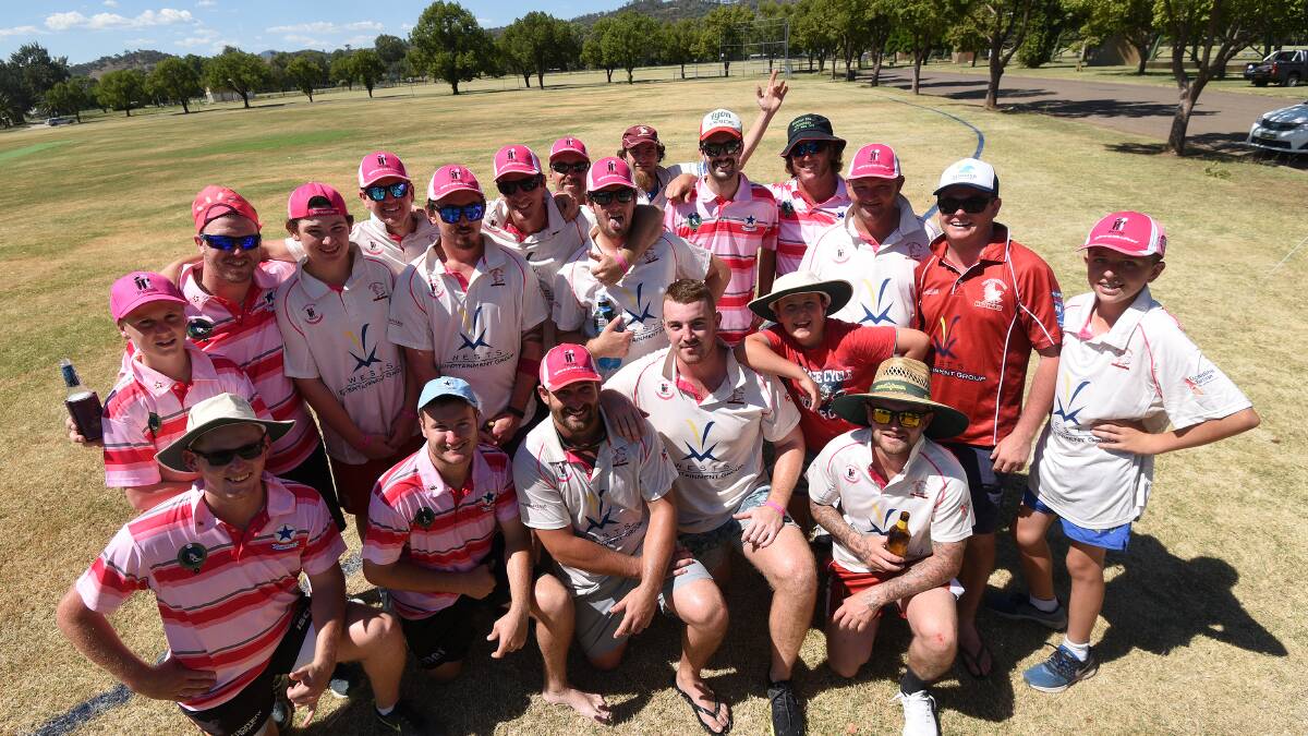 Great effort: The Wests and Old Boys players gather after their muck around game as part of West's Pink Stumps fundraising efforts. Photo: Gareth Gardner