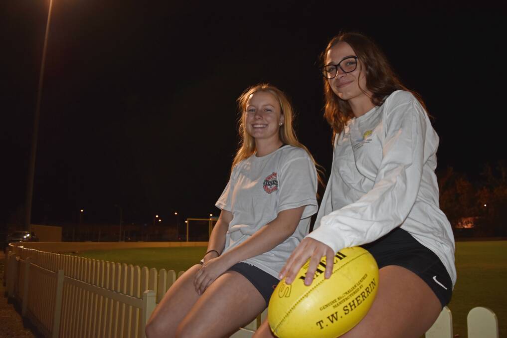 Kicking goals: Tamworth Swans recruits Lara Taggart (right) and Billie Mitchell have made an impressive transition to AFL. Photo: Ben Jaffrey