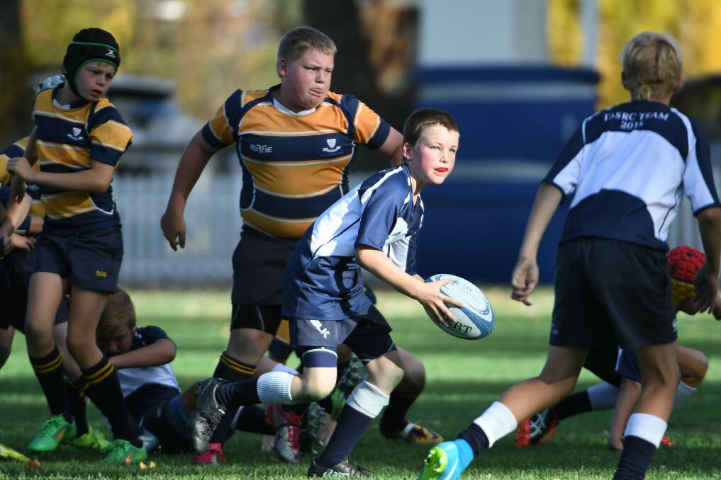 Banjo Lawrence gets the ball away for TAS in a match against Scone Grammar School at last year’s carnival. Photo: pixonline.com.au