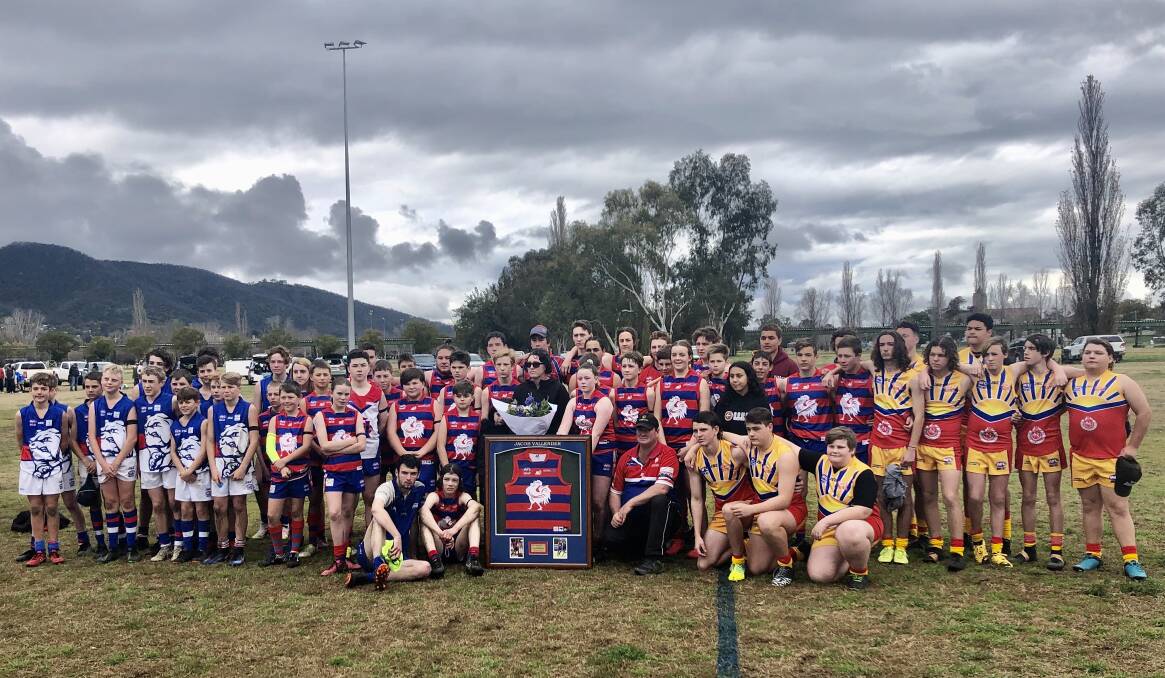 Tribute: The Tamworth Roosters, Gunnedah Bulldogs under-14s and Moree Suns under-17s come together after Saturday's Jacob Vallender Memorial Round games. Photo: Supplied