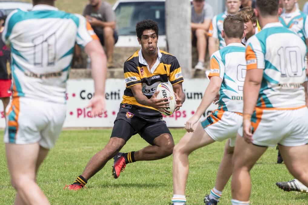 Fleet-footed: Armidale's Elijah Rasiga looks to dance his way around the East Coast Coast defence during the Greater Northern Tigers' big win on Saturday. Photo: Peter Hardin 180317PHC108