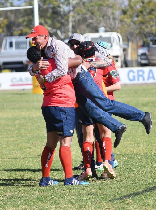 Torika Nadruku lifts up Gunnedah coach John Hickey in the aftermath of Saturday's preliminary final win.