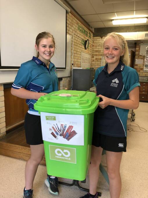 CONTEST: Armidale Secondary College students Belle Mitchell and Mikayla Tombs encourage city residents to drop in old toothbrushes. Picture: Supplied
