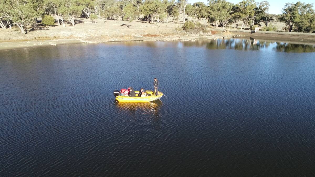 Aerial view of NSW Police divers search Dumaresq Dam 