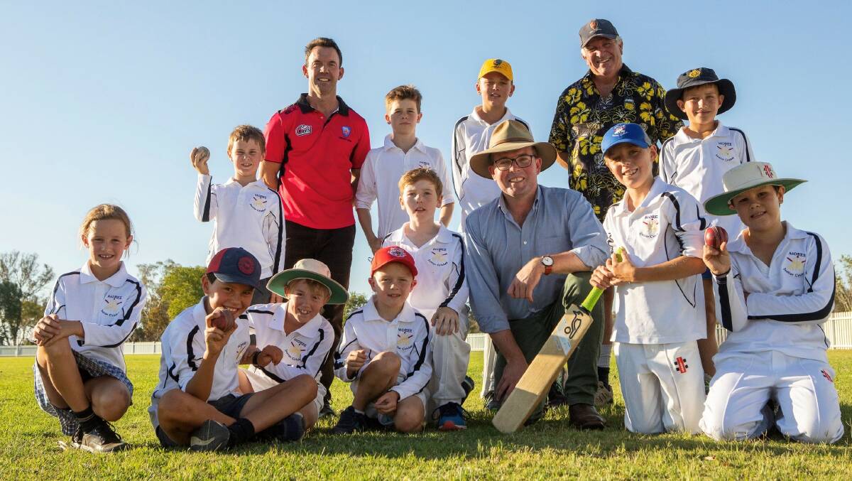 LIGHT IT UP: Launching the new Ron Harborne Oval lights, Cricket NSWs Vincent Cameron, left, Moree Plains Shire Councillor Mike Montgomery and Northern Tablelands MP Adam Marshall with players from Moree Junior Cricket Association. Photo: supplied.