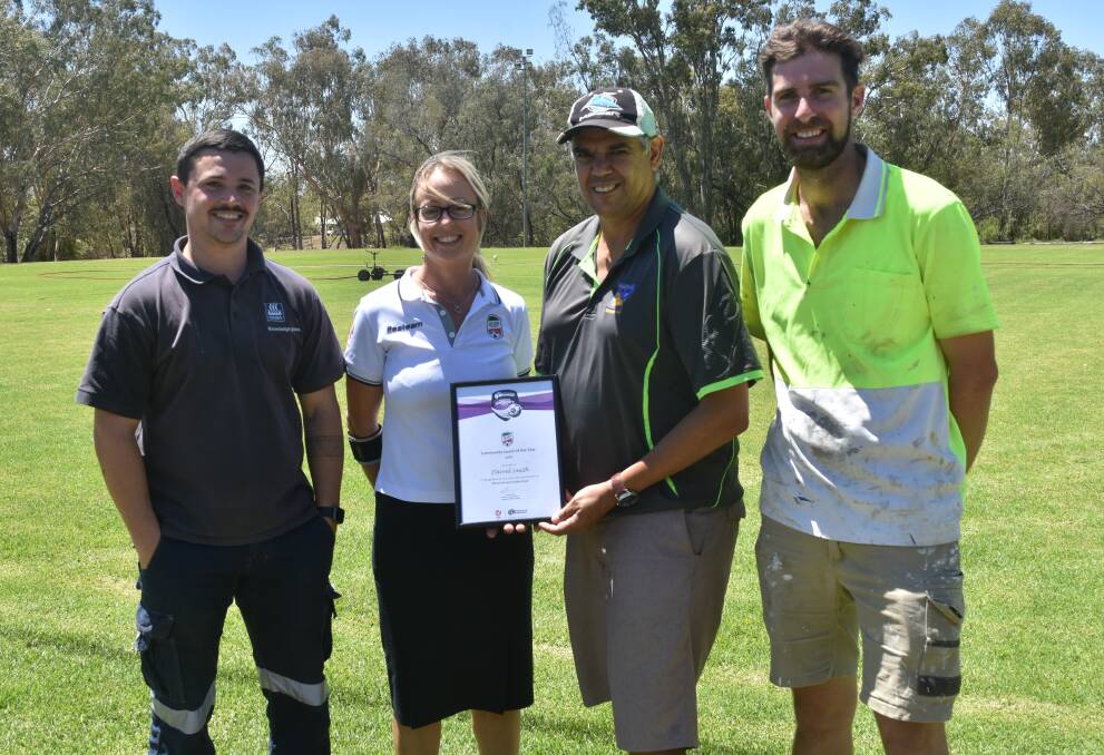 COACH OF THE YEAR: Moree Services FC coach Matt Urquhart, Northern Inland Football general manager Julia Farina, Darrel Smith and outgoing president Alex Madden.