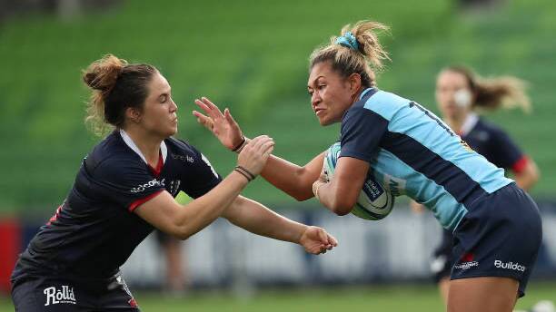 Ash Walker attempts to tackle an opposing Waratahs player in a match for the Melbourne Rebels. Photo: contributed.