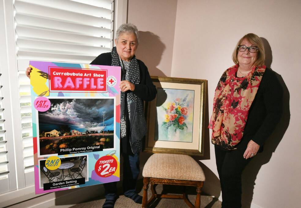 AMAZING ART: Elizabeth Henderson and Alitia Norman are gearing up for the Currabubula Art Show later this month. The painting on the chair was done by Fred Powell, who has previously entered into the competition. Photo: Gareth Gardner