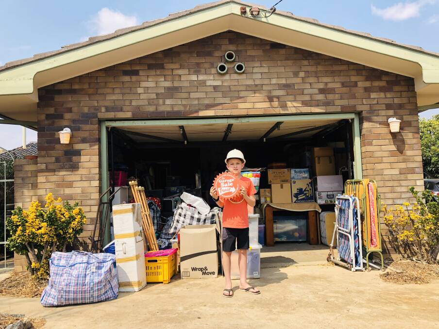 Tamworth resident Caroline Rothwell's grandson, Delko, is ready to help out at his grandmother's garage sale on the weekend. Photo: supplied