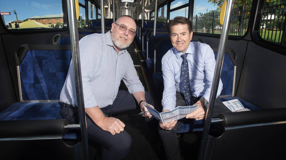 Tamworth Buslines manager Chris Lanham discusses the new routes with Tamworth MP Kevin Anderson. Photo: Peter Hardin