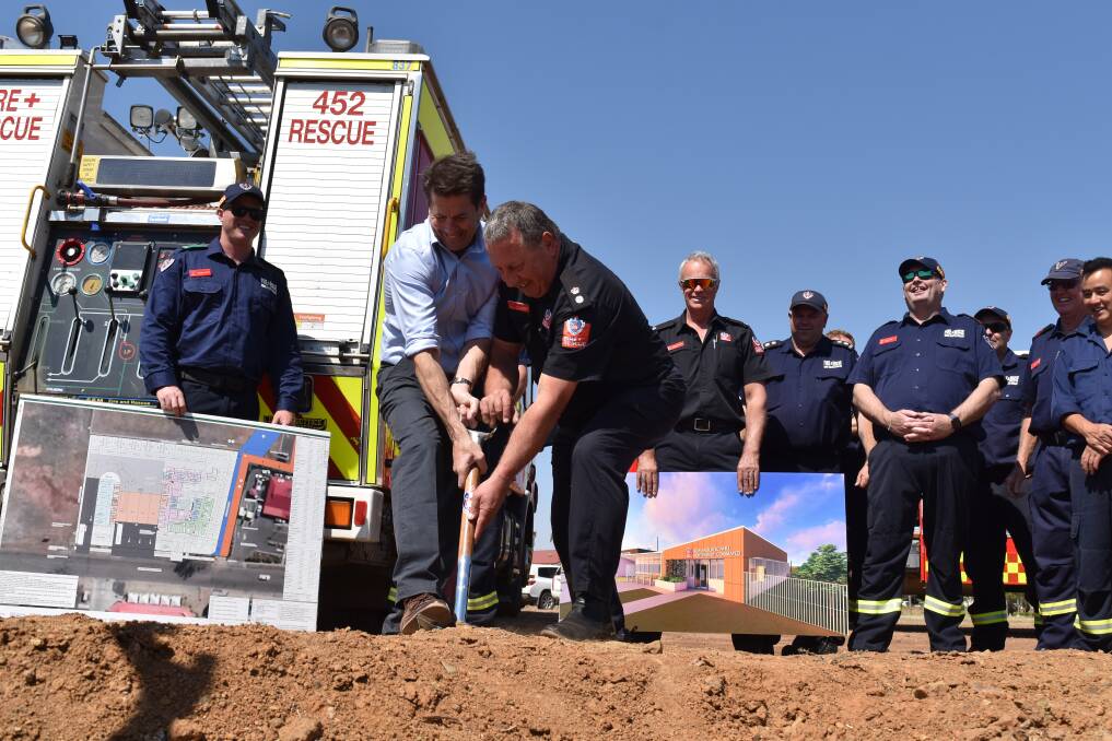 BUILDING BEGINS: Tamworth MP Kevin Anderson turns the first sod at the Ringers Road site with Fire and Rescue NSW's Tom Cooper. Photo: Ben Jaffrey 20191015BJA19