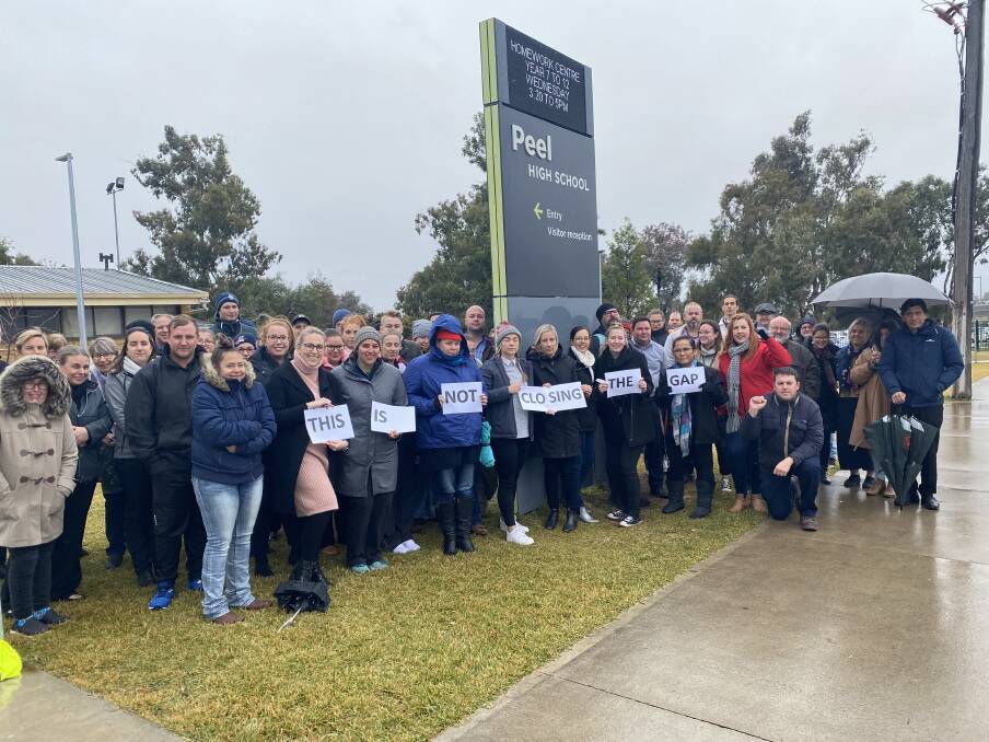 STRIKE OUT: Peel High School teachers braved the cold and wet Thursday morning for the strike. Photo: NSW Teachers Federation