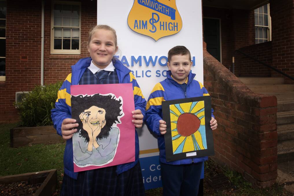 FUTURE ARTISTS: Tamworth Public School students Lilly Cullinan and Winslow McDonald show off their artworks chosen for the competition. Photo: Peter Hardin