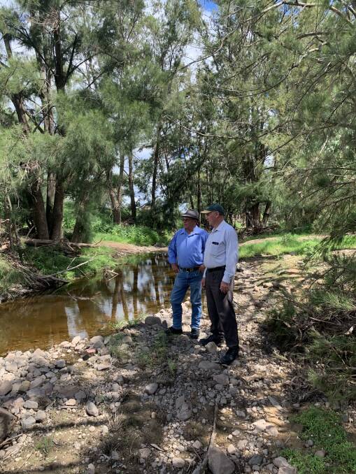 Liverpool Plains Kokoda Memorial Walkway Incorporated chair Doug Hawkins and vice president David Wallace survey part of the proposed route, at the Quipolly Creek crossing, where it is proposed an army style Bailey Bridge will be part of the infrastructure. Photo: supplied