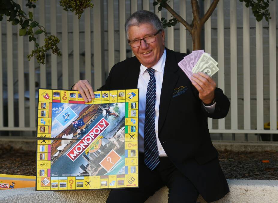 ROLL THE DICE: Tamworth mayor Col Murray with a Monopoly Australia board. Soon, he'll be holding up Tamworth's very own game. Photo: Gareth Gardner