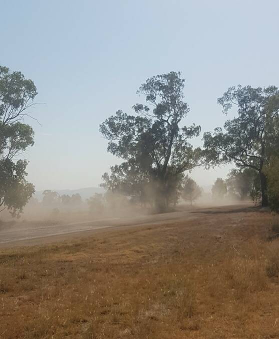 DUSTY HAZE: With trucks travelling at 100km/h, the dust from the unsealed road flies up. Photo: Derek Talbott.