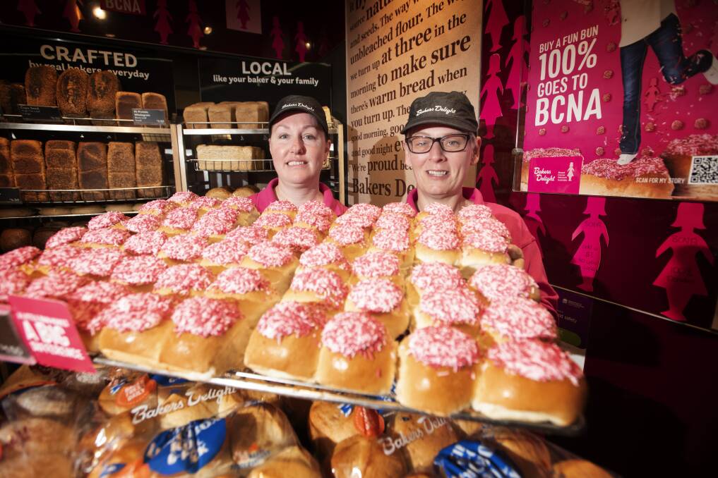 PRETTY IN PINK: Bakers Delight Tamworth City Plaza's Naomi Adams and Leanne Maslen with some delicious pink buns. Photo: Peter Hardin
