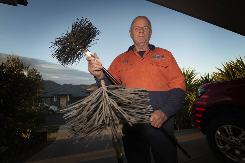 HARD WORK: Tamworth chimney sweep Kevin Howe has been flat out cleaning up fireplaces in the area. Photo: Peter Hardin