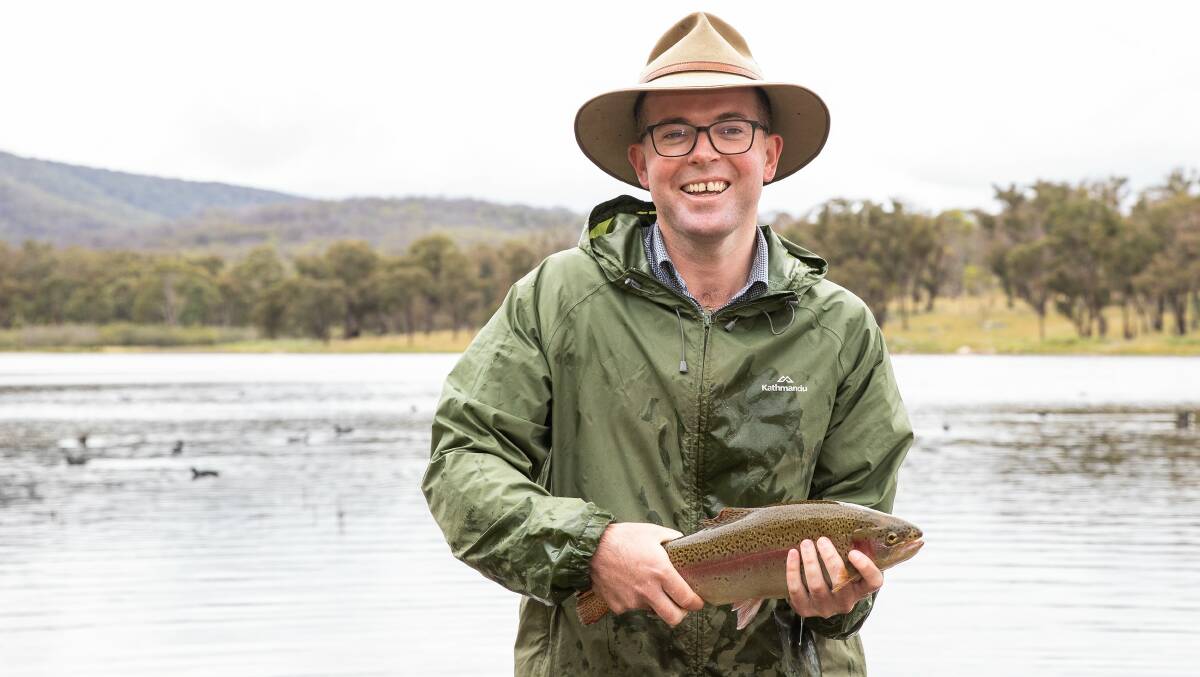 FRESH FISH: Minister for Agriculture and Member for Northern Tablelands Adam Marshall helped release more than 1000 rainbow trout into Dumaresq Dam, as part of the NSW Governments state-wide fish-restocking program. Photo: supplied