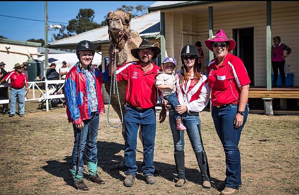 The crew from Oakfield Ranch near Maitland are looking forward to heading to the Quirindi Camel Cup. Pictured are Emily Parrott, jockey, Rodney Sansom, cameleer, Chontelle Jannese, jockey - holding little Abby Parrott, and Diane Gooley. Photo: supplied