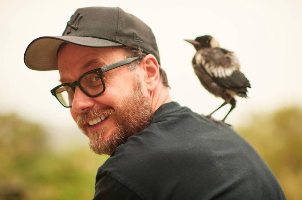 PERCHED: 'Penguin Bloom' film director Glendyn Ivin with baby magpie Penguin. Photo: Cameron Bloom