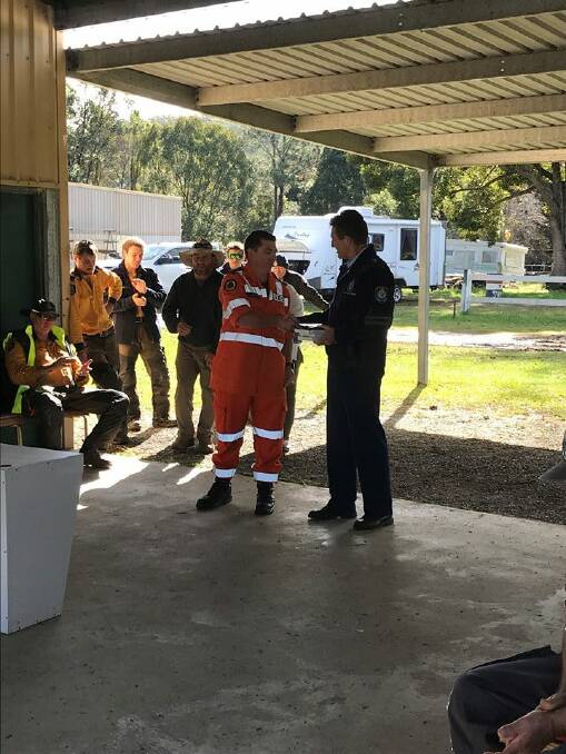 Recognition: NSW SES Port Macquarie Hastings Local Controller Paul Burg accepts the plaque. Photo: NSW SES - Mid North Coast Region.