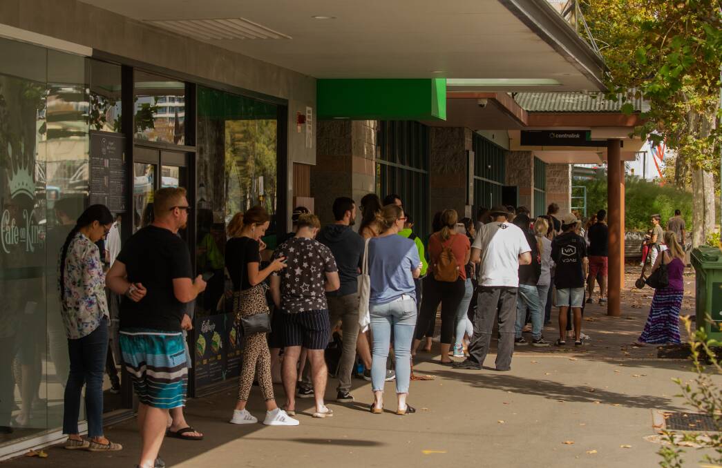 CRISIS: A queue outside the Centrelink office on King Street in Newcastle in late March after goverment restrictions were imposed on multiple industries. Picture: Marina Neil