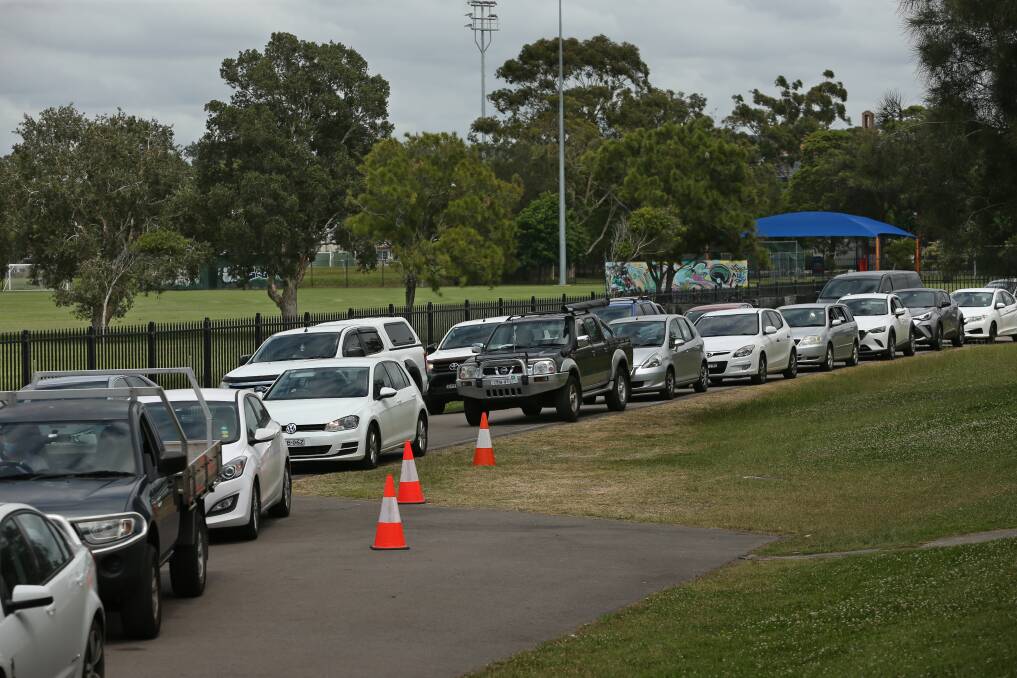 LONG WAIT: Motorists lined up for testing in Newcastle. 