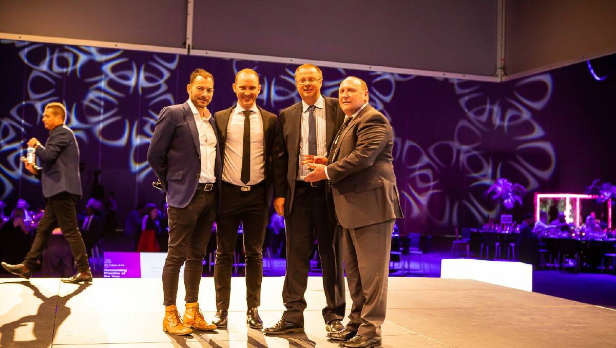 PRESENTATION: Clint Bourke (middle left) and Joel Weier (middle right) receive the MYOB Accounting Practice of the Year 2019 award. Photo supplied.