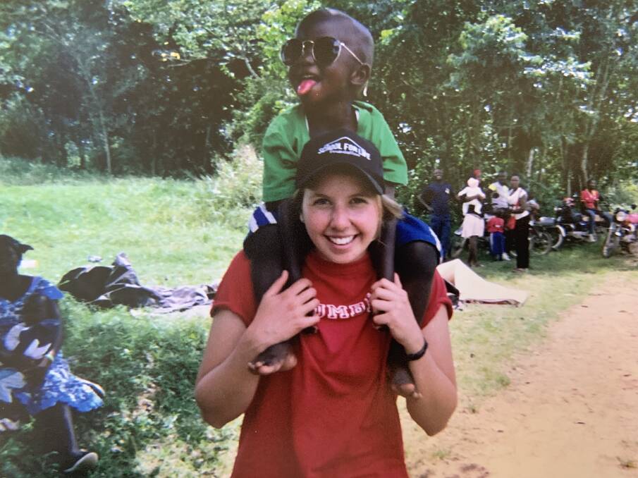 TRAVELLER: Andréa Jaggi with a young Ugandan friend. Photo supplied.