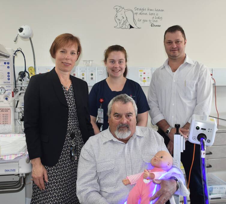 HELPING BABIES: Armidale Hospital's Dr Elizabeth Coterall, clinical midwifery educator Melissa Barnett, director of nursing Hamish Yeates, and Suttons farm manager Chris Strahle (seated), with the new equipment. Photo: Nicholas Fuller