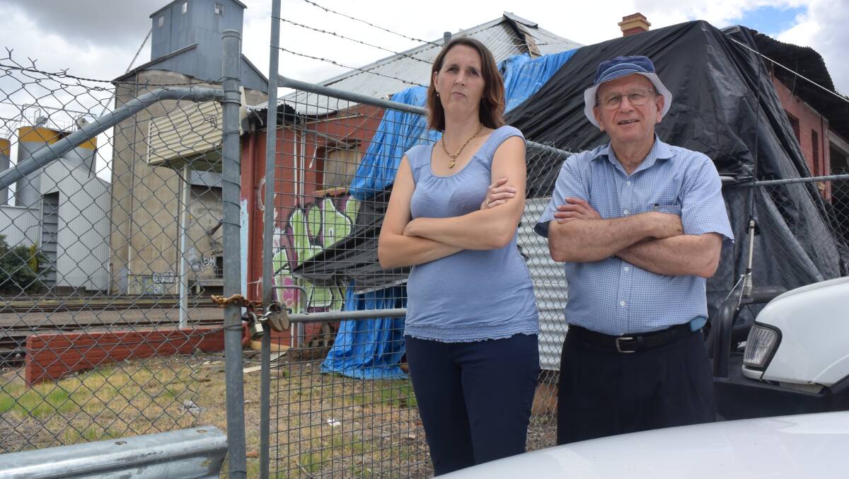 END OF THE LINE: Historical society members Melinda Gill and Rod Hobbs don't want the West Tamworth station torn down. Photo: Jacob McArthur