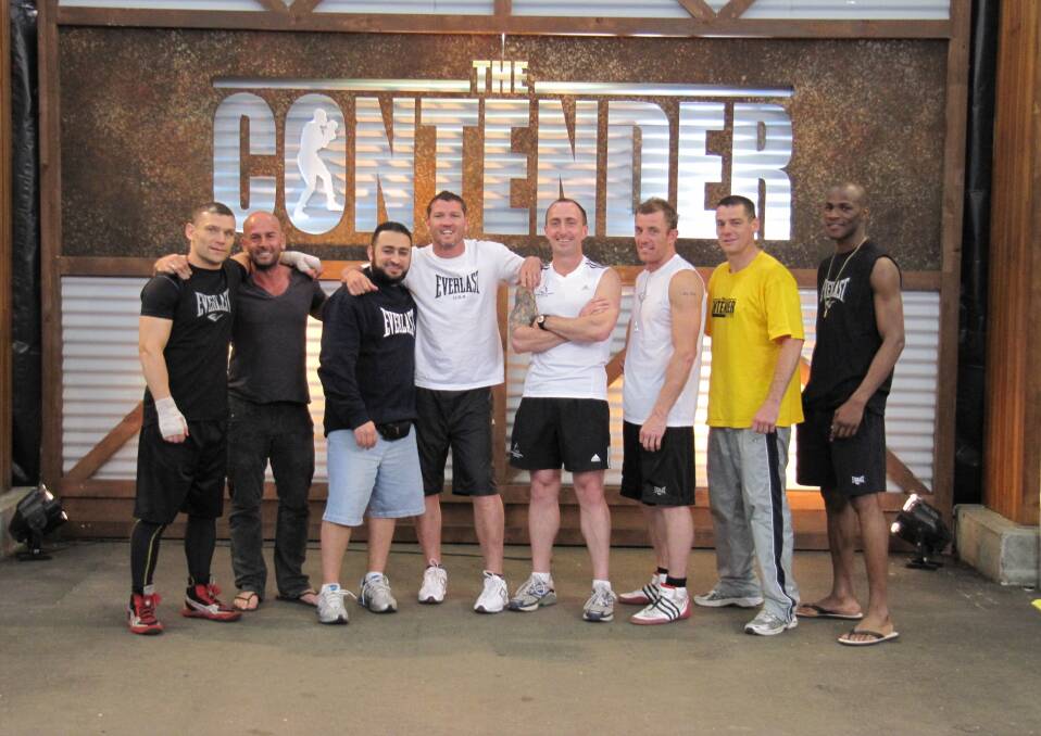 FIGHT TIME: Ray Kelly (middle) training aspiring boxers on The Contender. Photo: Supplied