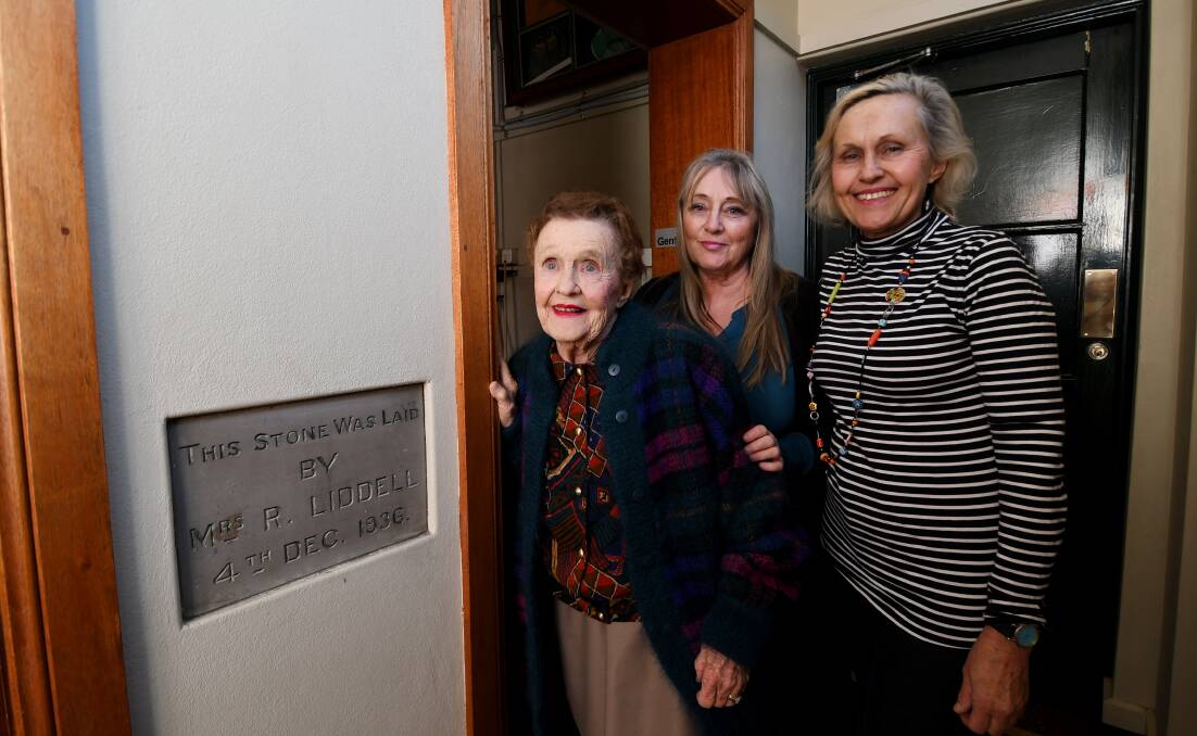 TOUCHSTONE: Elizabeth O'Hara, with daughters Jane and Louise Flaherty, next to the foundation stone her mother laid in 1936. Photo: Gareth Gardner 071018GGA15 
