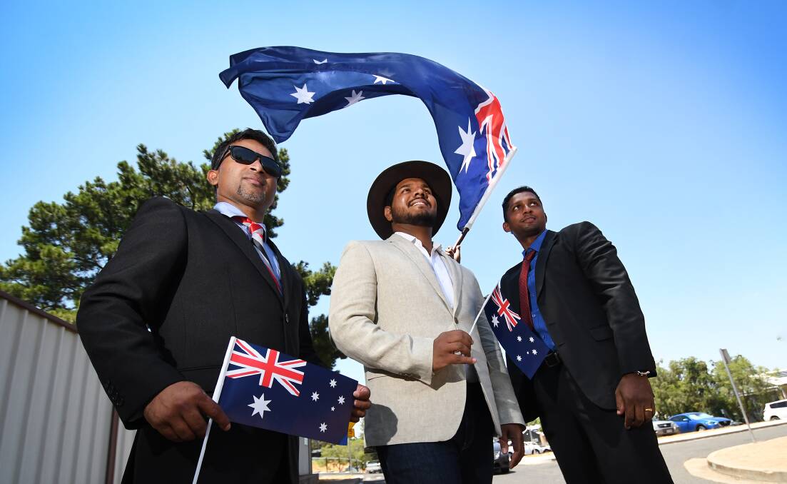 FLY THE FLAG: Jis Sebastian, Titus Alias and Jinto Joseph were among 24 people who became Australian citizens in Tamworth on Saturday. Photo: Gareth Gardner 260119GGB23